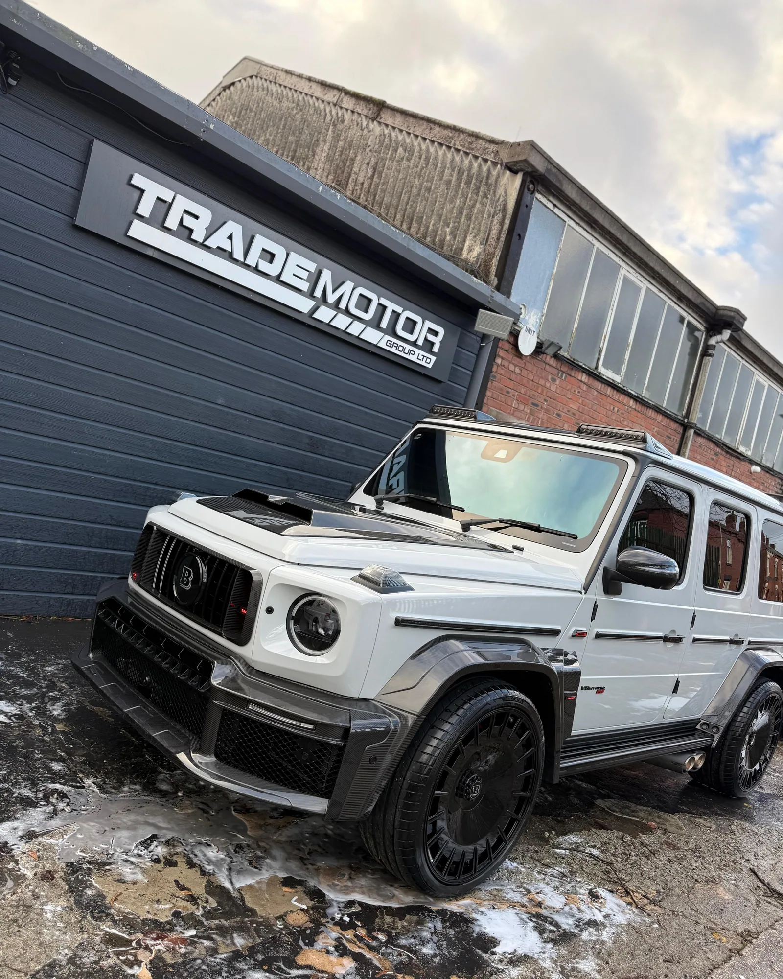 White Brabus G-Class during exterior wash stage outside the detailing bay