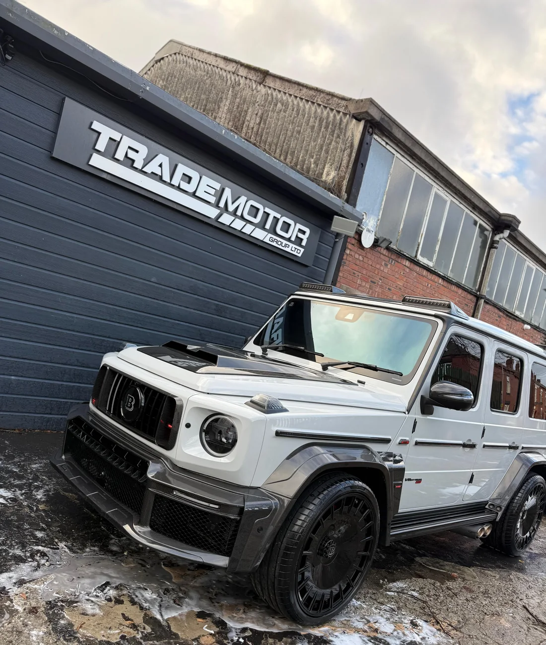 White Brabus G-Class front exterior and carbon trim during detailing